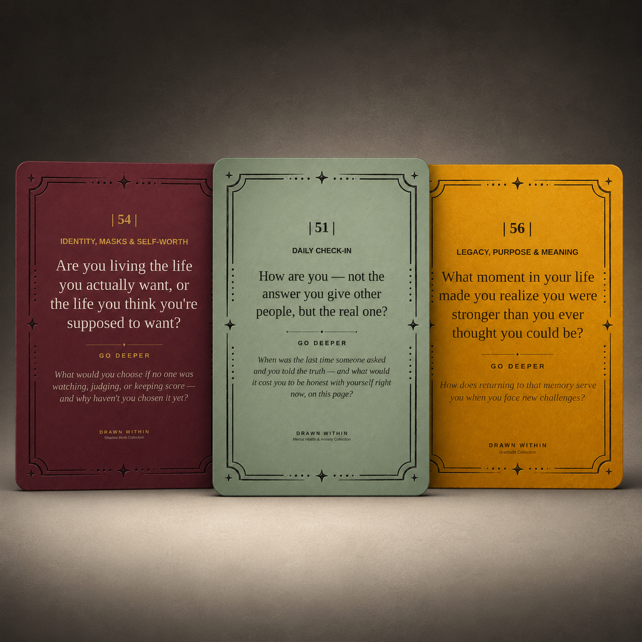 Three Drawn Within prompt cards — burgundy, sage, and gold